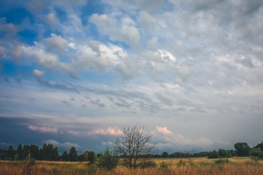 Wide blue sky above rural area landscape photo