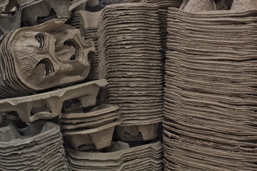 Eco package product from recycled pulp carton. Nature protection, environmental conservation, zerowaste, eco-friendly concept. Mold box from biodegradable waste paper material. Sustainable technology photo