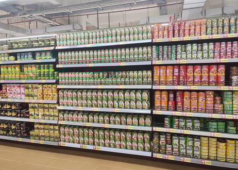 Solo, Indonesia - February, 2023 - display rack of various canned food products in a supermarket photo