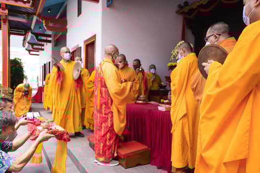 Bandung City, Indonesia, 2022 - Buddhist community praying together with the monks in front of the altar photo