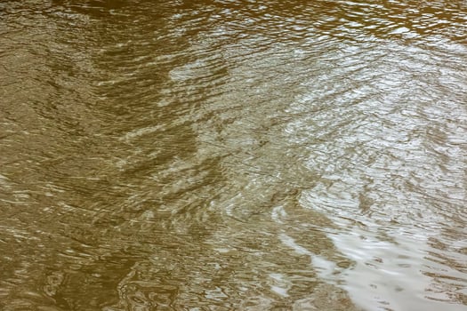 River water background with waves and ripples. Nitra river in Slovakia. photo