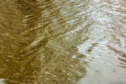 River water background with waves and ripples. Nitra river in Slovakia. photo