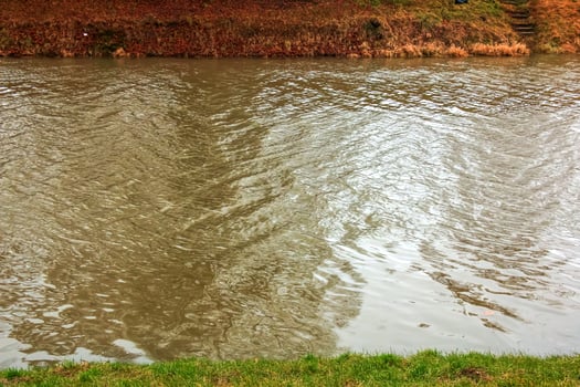 River water background with waves and ripples. Nitra river in Slovakia. photo