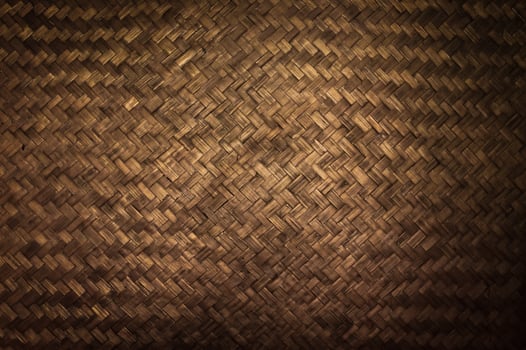 Dark Texture of bamboo handicraft detail , Pattern of Thai style bamboo handcraft texture background , vintage wall photo