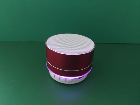 Wireless speaker spins on a stand photo