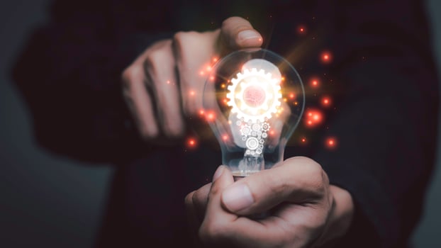 Businessman holding a light bulb, Creative new idea. Innovation, brainstorming, solution and inspiration concepts. imagination, creative thinking problem solving... photo