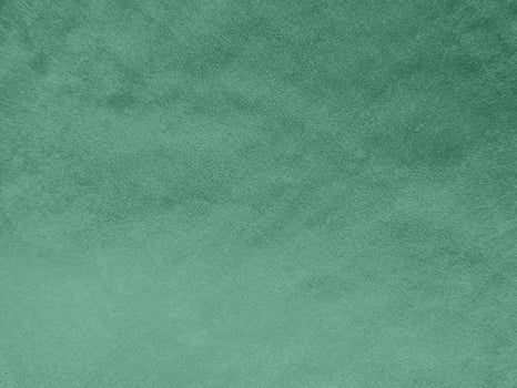 Padua green velvet fabric texture used as background.Light green fabric background of soft and smooth textile material. There is space for text. photo
