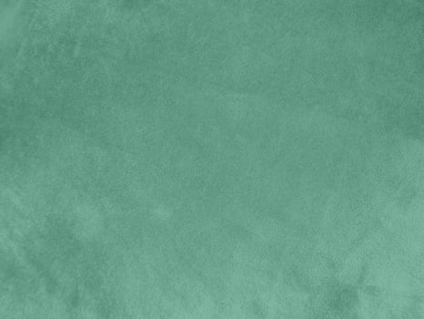 Padua green velvet fabric texture used as background.Light green fabric background of soft and smooth textile material. There is space for text. photo