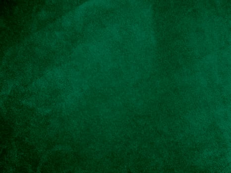 Dark green old velvet fabric texture used as background. Empty green fabric background of soft and smooth textile material. There is space for text.. photo