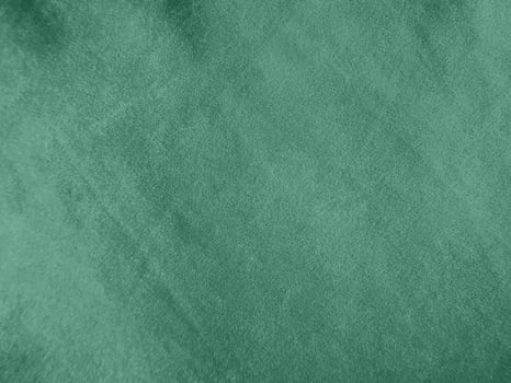Padua green velvet fabric texture used as background.Light green fabric background of soft and smooth textile material. There is space for text. photo