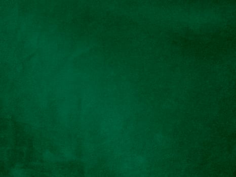 Dark green old velvet fabric texture used as background. Empty green fabric background of soft and smooth textile material. There is space for text.. photo