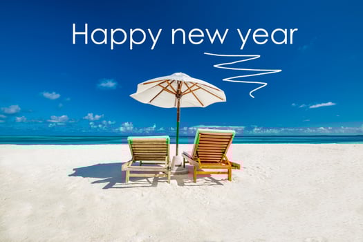 Happy New Year letters on sandy beach, exotic summer landscape background. New Year beach concept design. Famous tropical travel destination to celebrate New Years Eve photo
