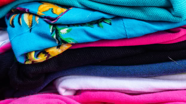 stack of clothes as background photo