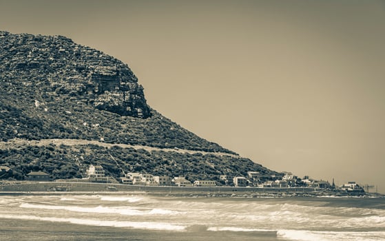 Fish Hoek Beach at False Bay turquoise water Cape Town. photo