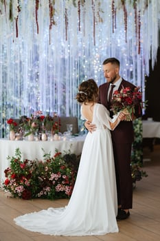 portrait of a young couple of newlyweds in wedding looks photo