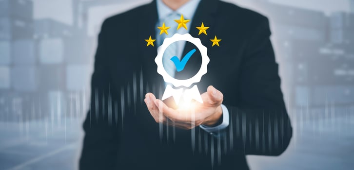 Quality assurance of business services and five star, Businessman hand shows the sign of the top service Quality assurance, Guarantee, Standards, ISO certification and standardization concept. photo