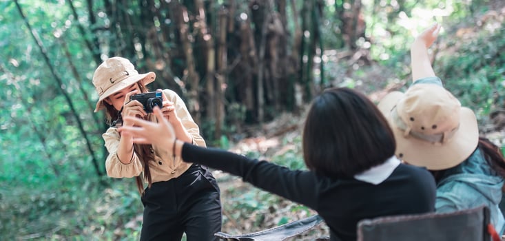 Young pretty woman use camera taking photo her friends