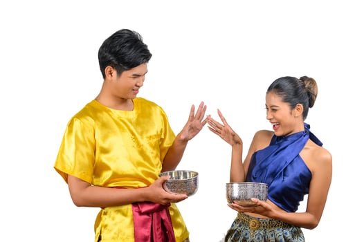 Young couple enjoy with water bowl on Songkran festival photo