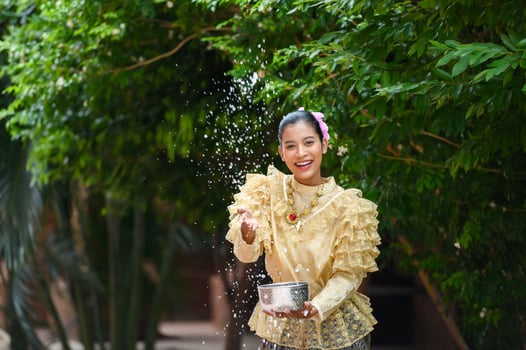 Portrait beautiful woman in Songkran festival with Thai Traditional costume photo