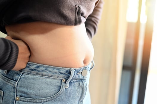 Fat woman measuring , fat woman fat belly chubby paunchy sport recreation health care lose belly fat do not exercise concept photo
