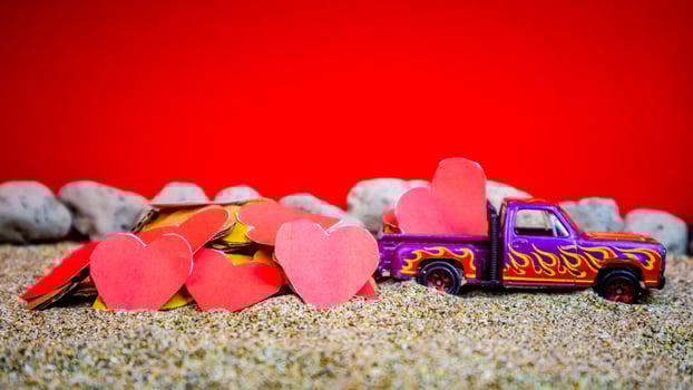 Minahasa, Indonesia December 2022, the toy cars transporting hearts photo