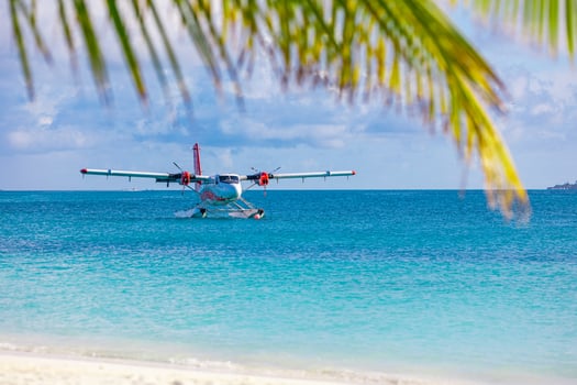 Sea plane at tropical beach resort. Luxury summer travel destination with seaplane in Maldives islands. Exotic vacation or holiday transportation, Maldives sea photo