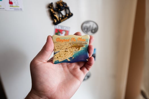 Biograd na Moru, Croatia souvenir refrigerator magnet at hand. photo