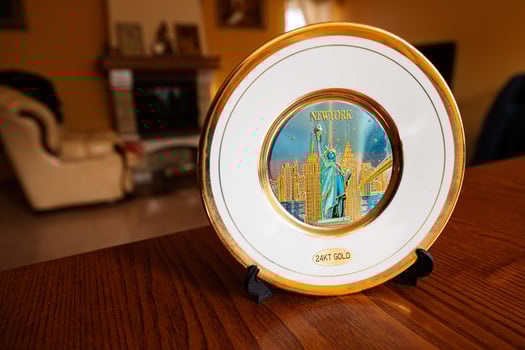 New York souvenir gold plate on a stand at home. photo