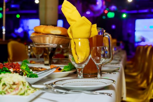 Beautifully decorated catering banquet table with different food snacks and appetizers photo