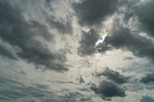 Dramatic storm clouds at dark sky in rainy season photo