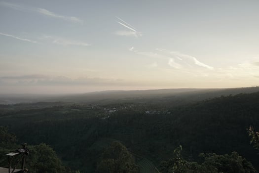 landscape portrait as the sun rises from the mountains. photo