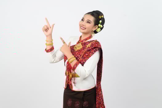 Young beautiful woman in northeastern dress stand and point finger posture photo