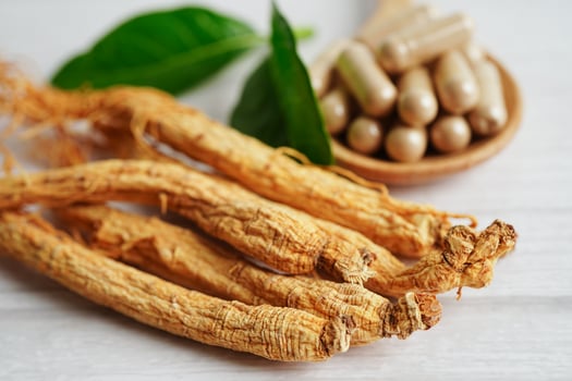 Ginseng roots and green leaf, healthy food. photo