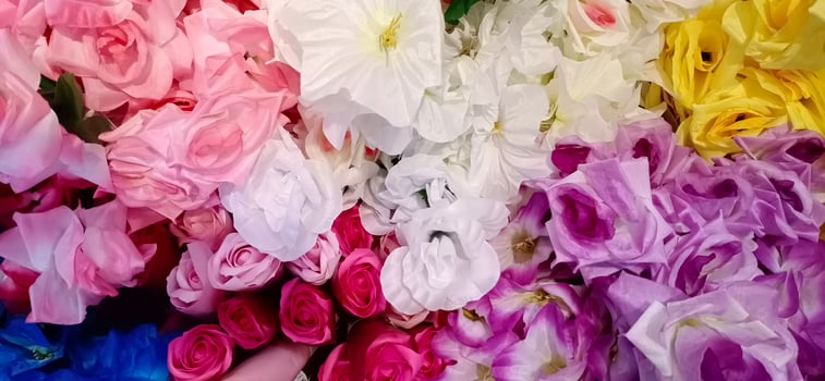 Artificial rose and flower background photo