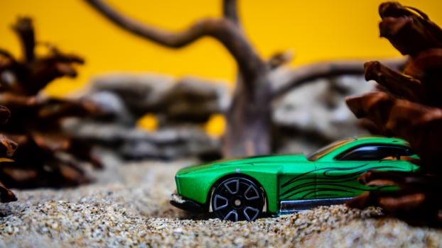 Minahasa, Indonesia  saturday, December 2022, a toy car among the pinecones photo