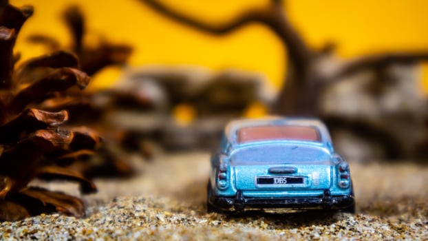 Minahasa, Indonesia  saturday, December 2022, a toy car among the pinecones photo