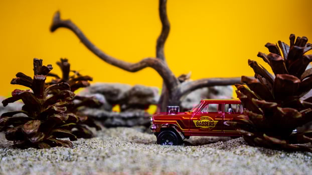 Minahasa, Indonesia  saturday, December 2022, a toy car among the pinecones photo