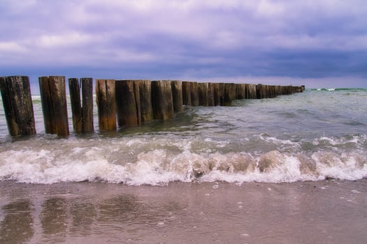 on the beach of the baltic sea in zingst. view of the sea with groyne. Landscape photo