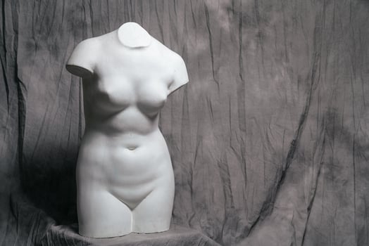 sculpture on a gray background plaster body sculpture photo