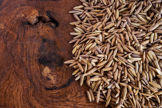 Purple rice seed on wood table photo