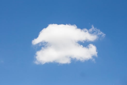 single cloud on blue sky background photo