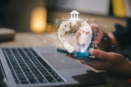 Women use mobile phones and laptop computers for money transfers and currency exchanges between countries of the world. online banking interbank payment concept. photo