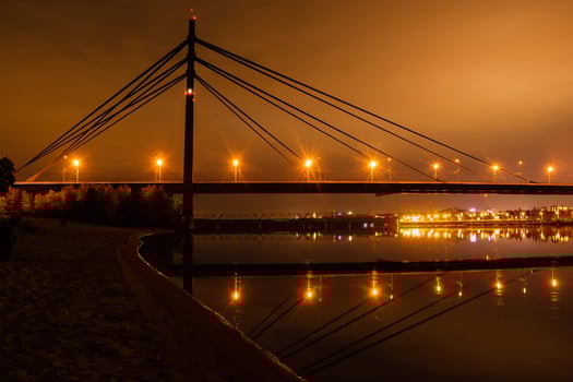 night city with reflection of houses in the river photo
