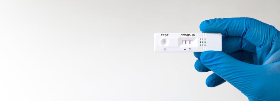 Positive test result by using rapid test device for COVID-19. photo