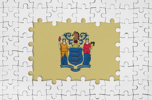 New Jersey US state flag in frame of white puzzle pieces with missing central part photo