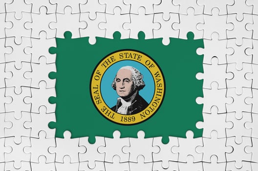 Washington US state flag in frame of white puzzle pieces with missing central part photo