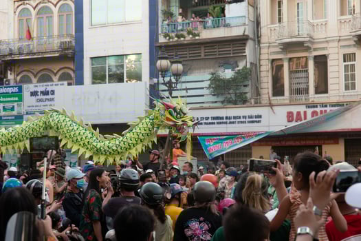 Ho Chi Minh city, Vietnam - 6 Feb 2023 Lunar New Year celebration - The dragon dance, beautiful colorful festive figure. Tet holiday background. Chinese Lunar New Year's Day, Spring Festival. photo