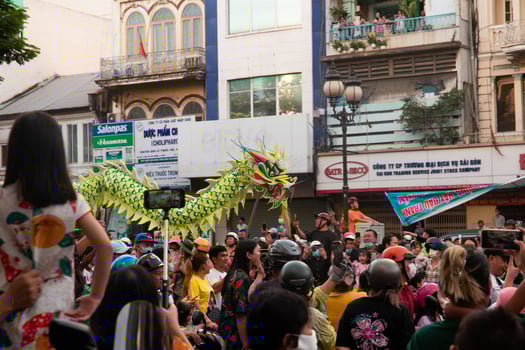 Ho Chi Minh city, Vietnam - 6 Feb 2023 Lunar New Year celebration - The dragon dance, beautiful colorful festive figure. Tet holiday background. Chinese Lunar New Year's Day, Spring Festival. photo