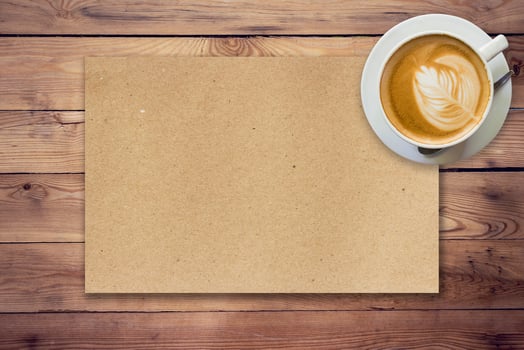 brown paper and coffee on wood background texture photo