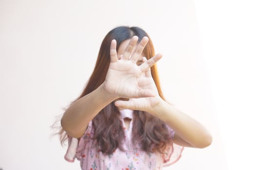Woman raised her hand for dissuade, campaign stop violence against women photo